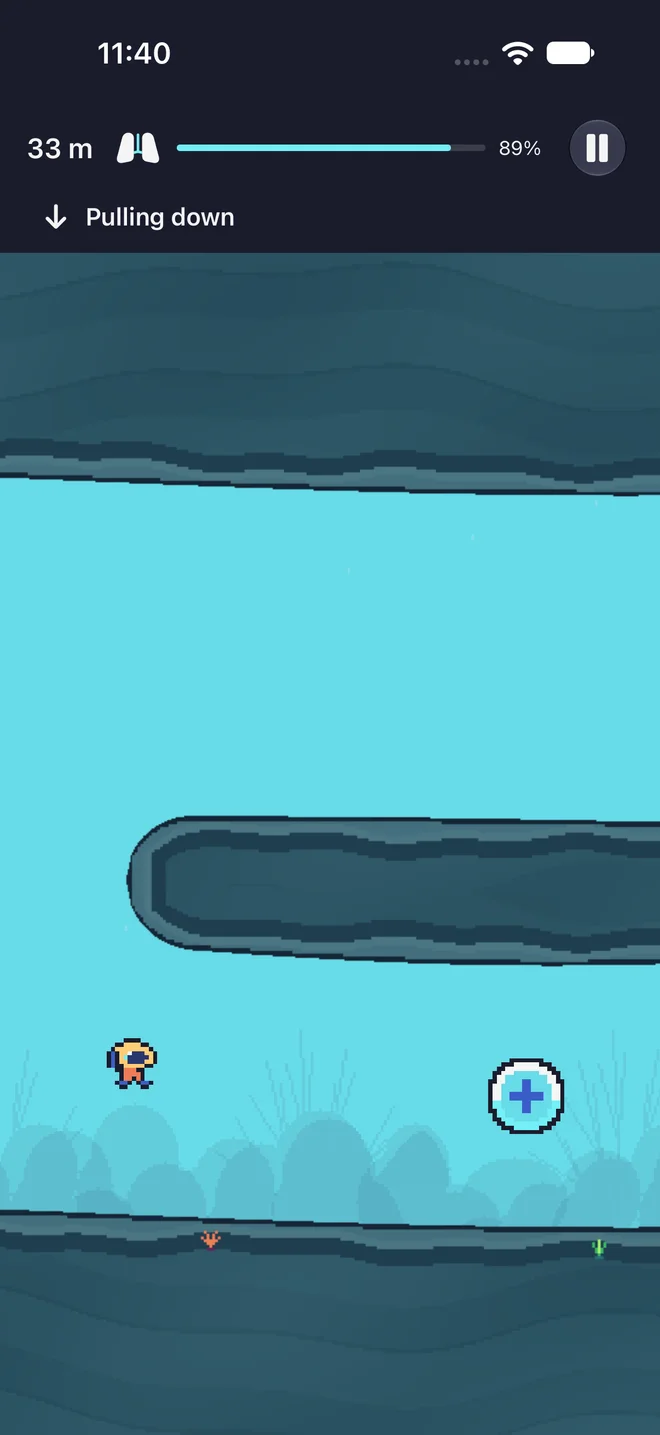 Actual Dinky Diver gameplay: Brass Bell approaching an air ring beneath a rocky cave shelf, with 89 percent air remaining